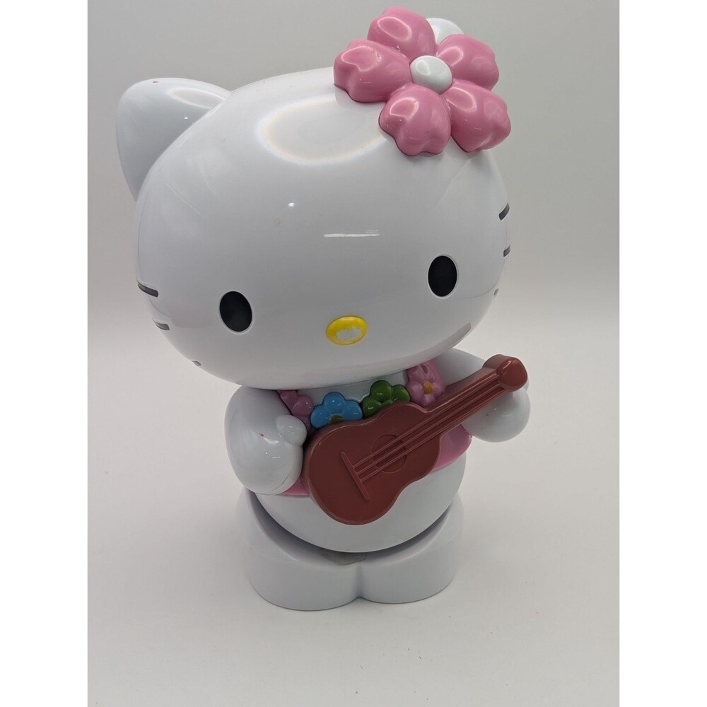 Sanrio Hello Kitty Hula Dancing Figure Battery Operated Hawaiian Ukulele...